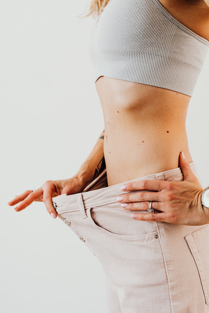Woman showing weight loss results with looser-fitting clothing, representing the BellaSlim medical weight loss program in Rancho Cucamonga, CA